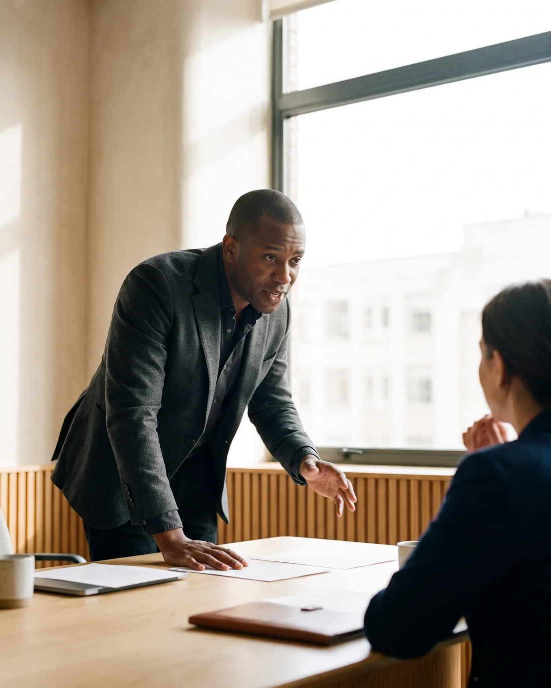 A senior CFO reviewing the work in a calm Netherlands boardroom