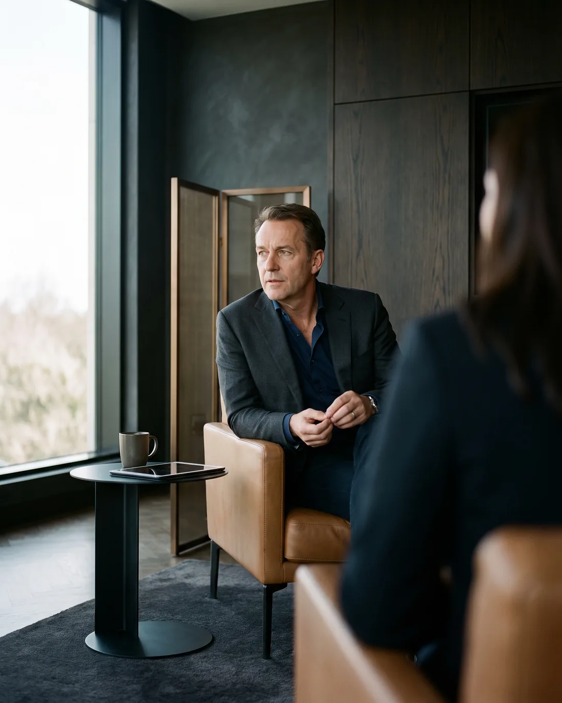 A senior CHRO reviewing the work in a calm Netherlands boardroom